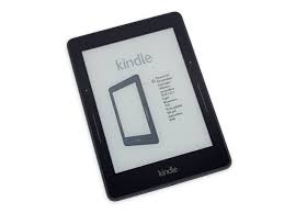 A basic Kindle is pictured to show the size of the device being created by scientists
