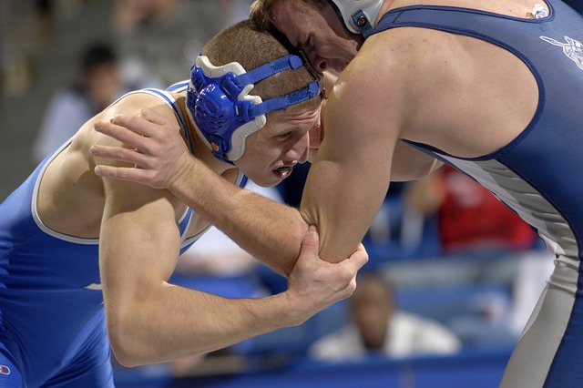 Two men wrestle